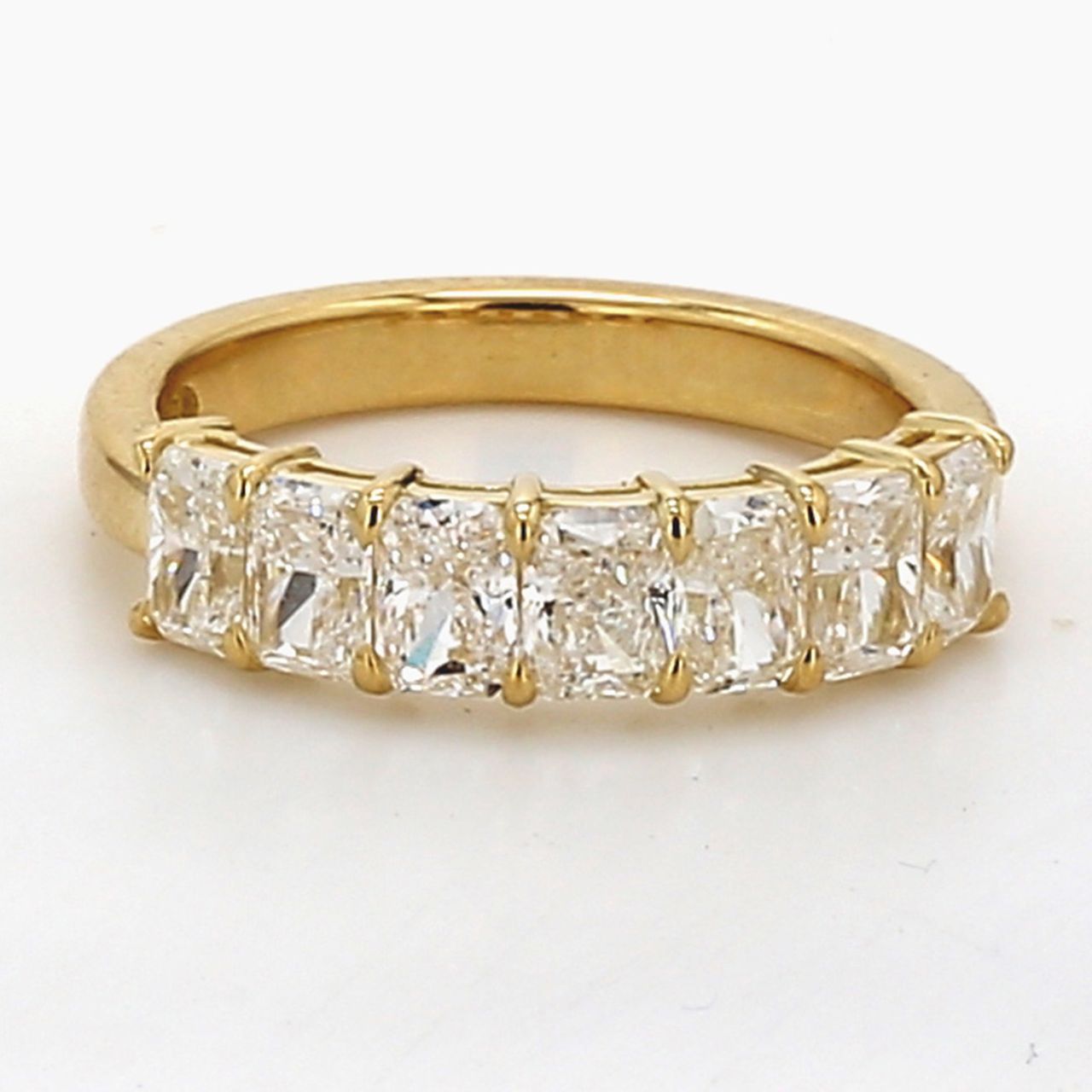 7-stone band in 18K YG with basket prong set radiant cut diamonds.  D1.74ct.t.w.  Size 5.75