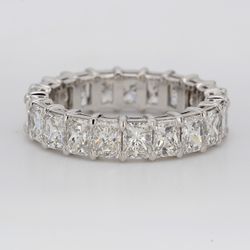 Eternity band in platinum with double basket shared prong set (21) radiant cut diamonds.  D5.48ct.t.w.  Size 7.25
