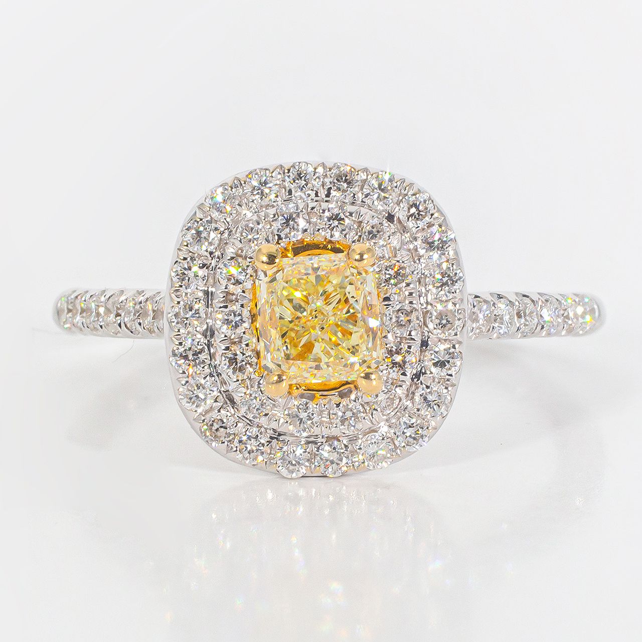 Double halo ring in 18K WG with rounds around a FY radiant cut diamond center stone.  D1.08ct.t.w.  (Center 0.63ct.)  Size 6.5