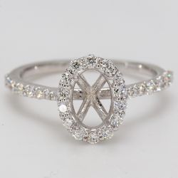 Halo semi-mount with U-prong set round diamonds.  D0.44ct.t.w.