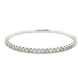 6.5' Light weight flexible oval shaped bangle with prong set round diamonds.  D1.85ct.t.w.