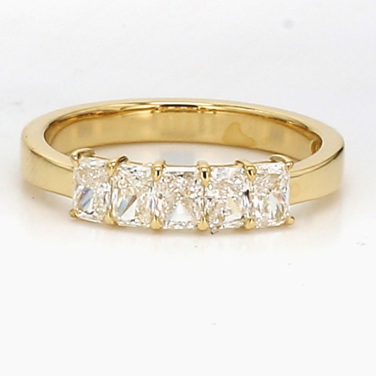5-stone band in 18K YG with basket prong set radiant cut diamonds.  D0.74ct.t.w.  Size 5