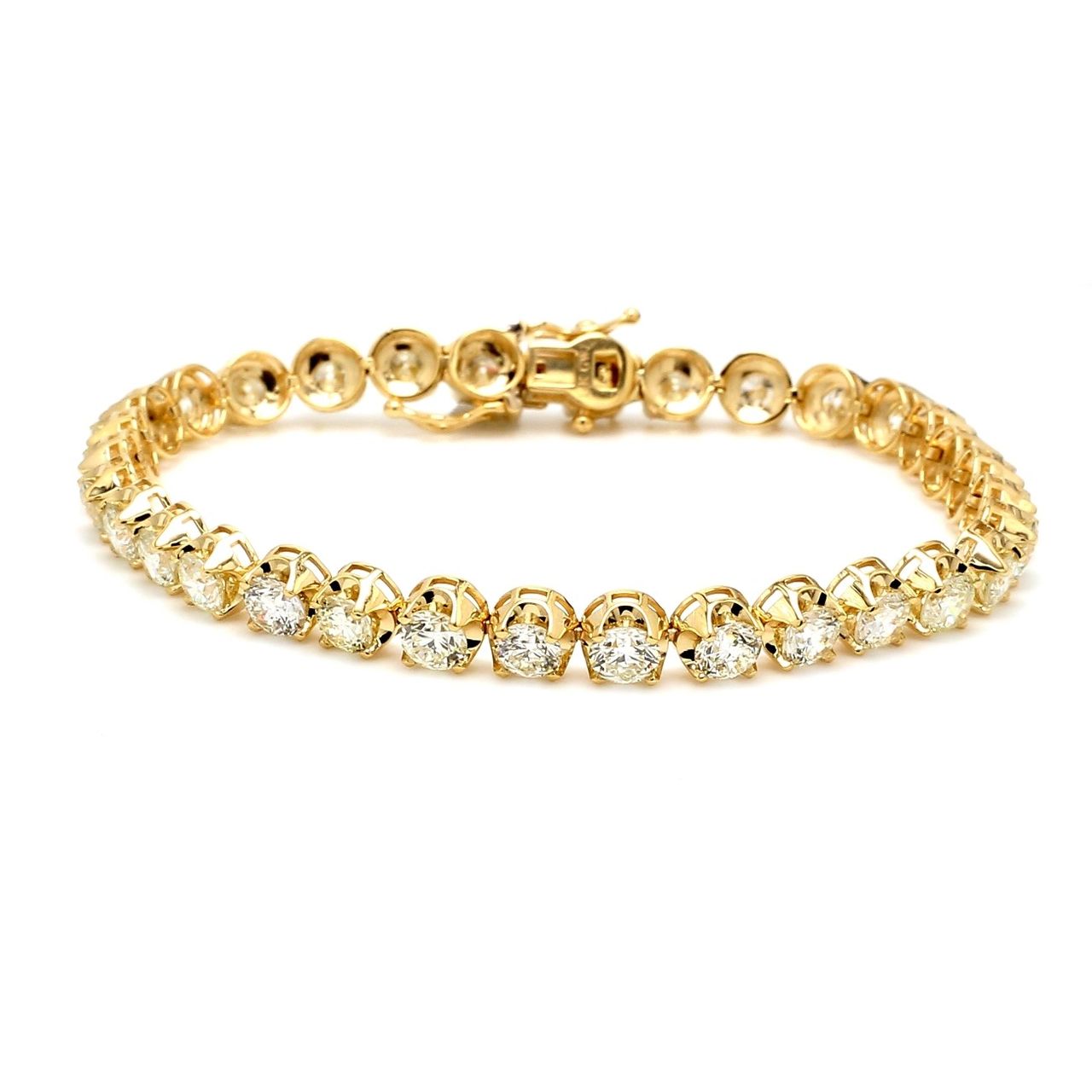 7' Tennis bracelet in 18K YG with crown style 4-prong set (27) round diamonds.  D13.59ct.t.w.