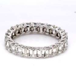 Eternity band in platinum with U-prong set (25) emerald cut diamonds.  D3.75ct.t.w.  Size 6
