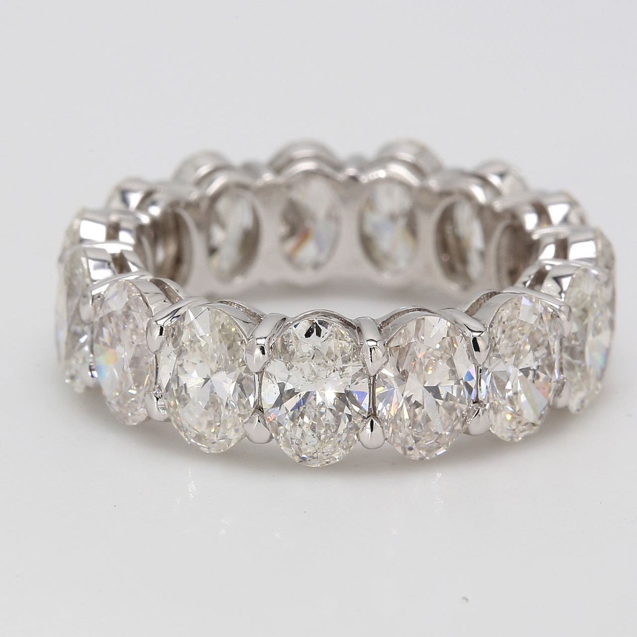 Eternity band in platinum with shared basket claw prong set GIA certified G-H/VS1-SI1 (15) oval diamonds.  D7.67ct.t.w.  Size 5.75