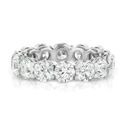 Eternity band in platinum with shared prong set (13) round diamonds.  D8.78ct.t.w.  Size 6.25