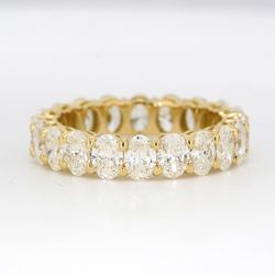 Eternity band in 18K YG with shared prong basket set oval diamonds.  D3.74ct.t.w.  Size 6