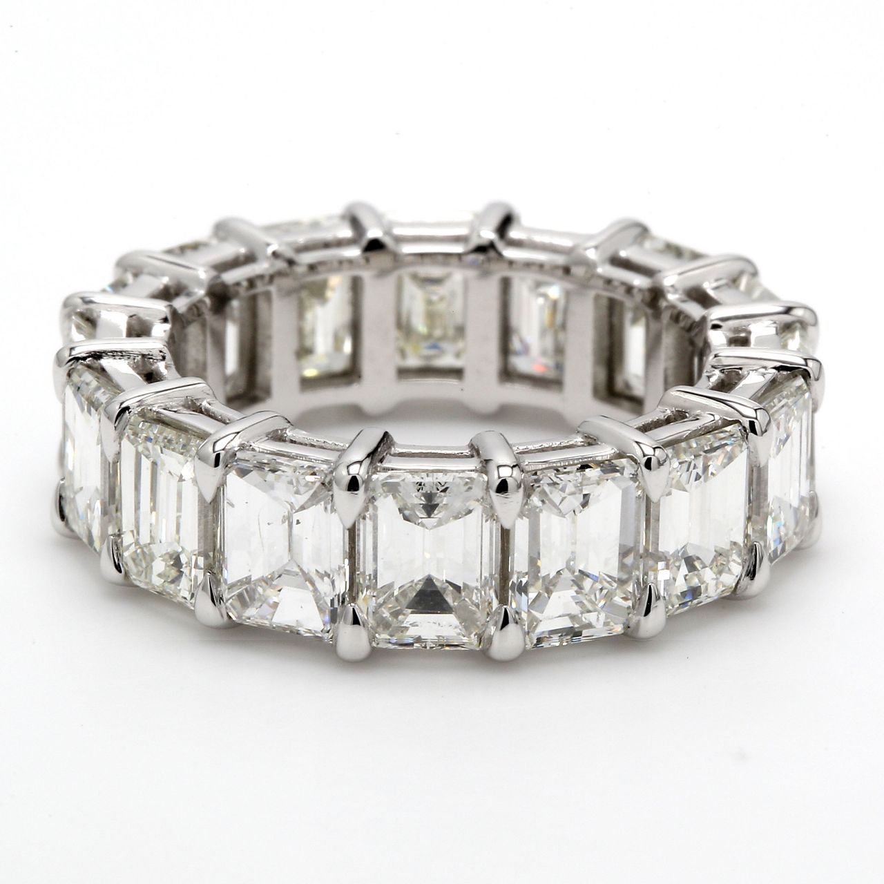 Eternity band in platinum with shared prong set emerald cut diamonds.  D9.05ct.t.w.