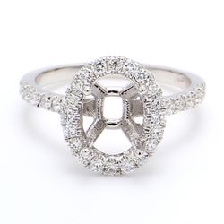 Halo semi-mount with U-prong set round diamonds.  D0.53ct.t.w.  Size 6