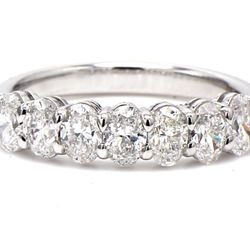 7-stone band in platinum with basket prong set oval cut diamonds.  D1.30ct.t.w.  Size 7