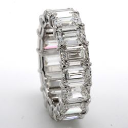 Eternity band in platinum with basket claw set GIA certified G-I/VVS1-VS2 (16) emerald cut diamonds.  D9.62ct.t.w.  Size 5.75