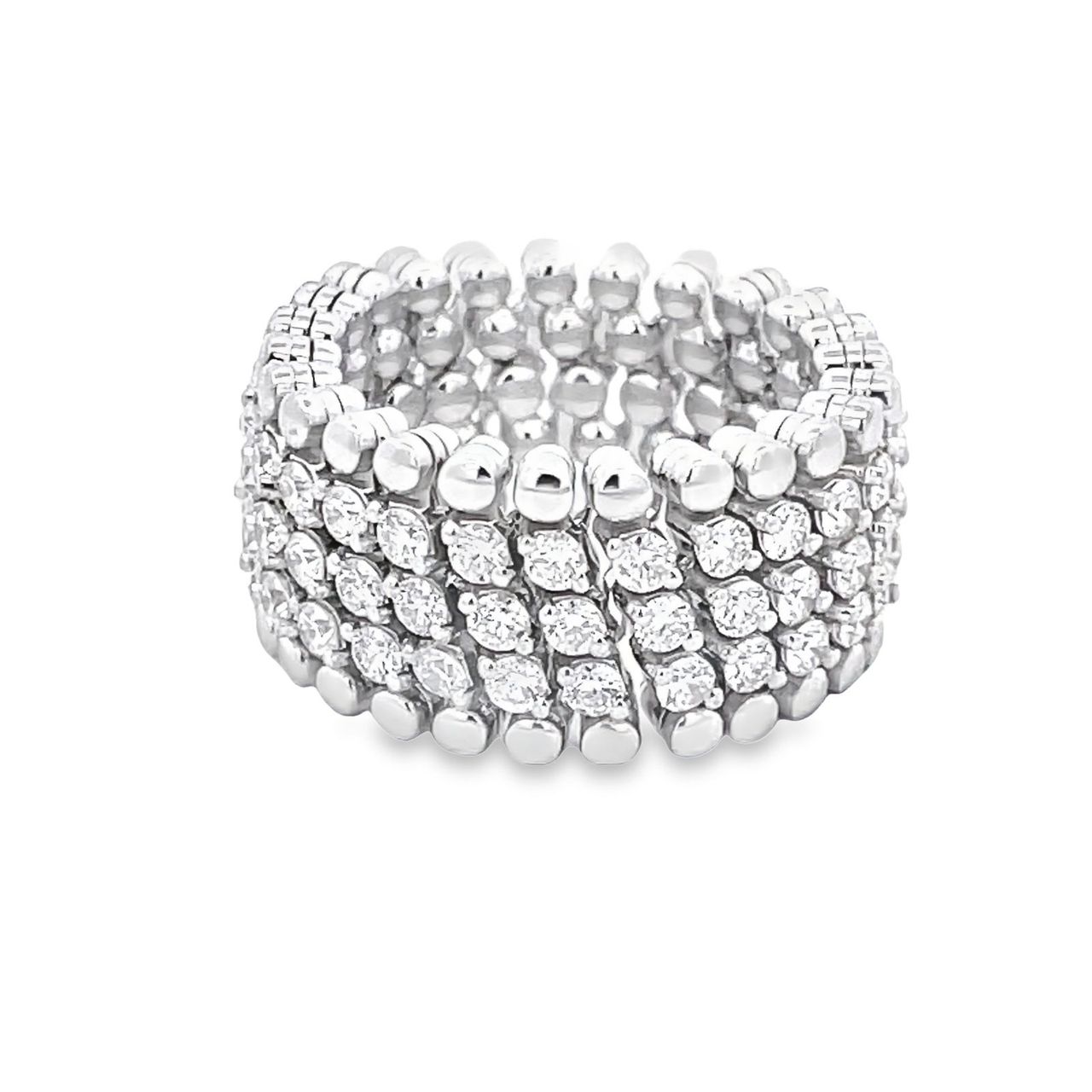 Flexible eternity band in 18K WG with prong set round diamonds.  D2.90ct.t.w.