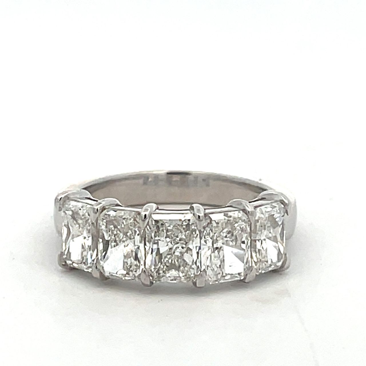 5-stone band in platinum with shared claw prong basket set G-H/SI1 GIA certified radiant cut diamonds.  D2.65ct.t.w.  Size 6