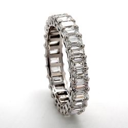 Eternity band with shared prong set (27) emerald cut diamonds.  D2.74ct.t.w.  Size 5