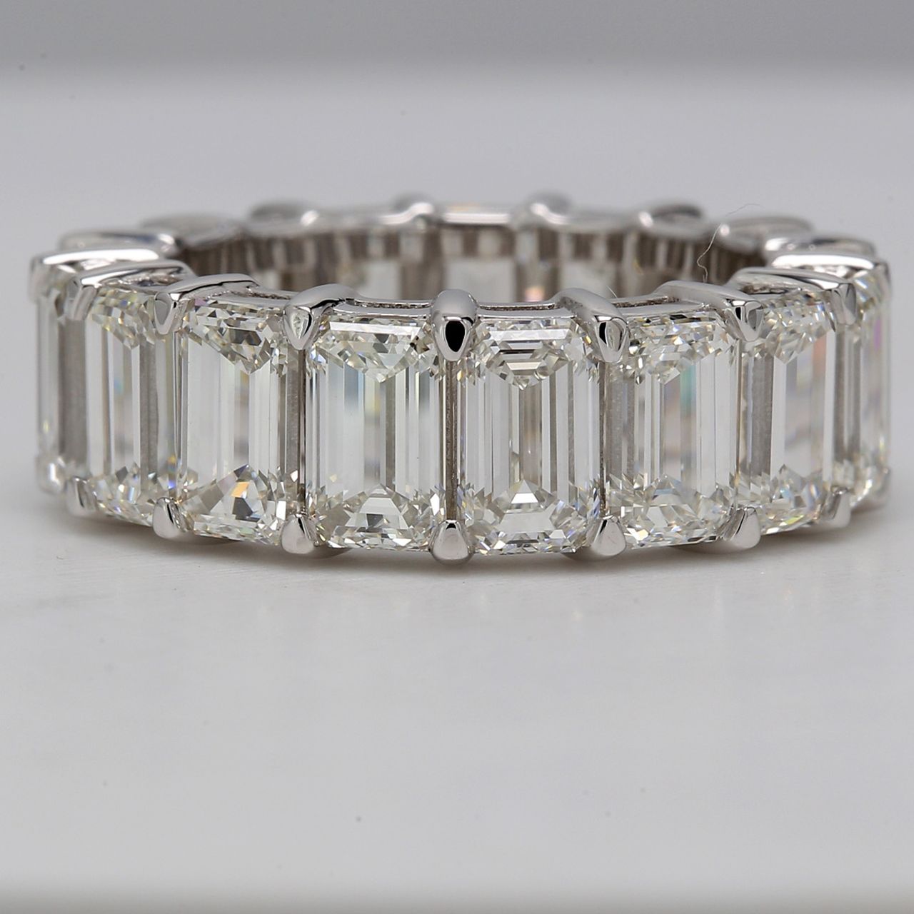 Eternity band in platinum with eagle claw basket set GIA certified H-I/IF-VS2 (17) emerald diamonds.  D12.33ct.t.w.  Size 6.25