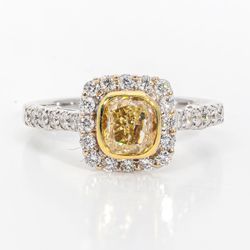 Halo ring in 18K WG with rounds around a bezel set FY cushion cut diamond center stone.  D1.50ct.t.w.  (Center 1.00ct.)  Size 6.75