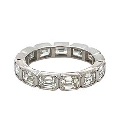 Eternity band east west style in platinum with bezel set (13) emerald diamonds.  D3.25ct.t.w.  Size 5