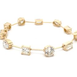 7' Fancy bracelet in 18K YG with basket prong set (11) multishape diamonds.  D11.14ct.t.w.