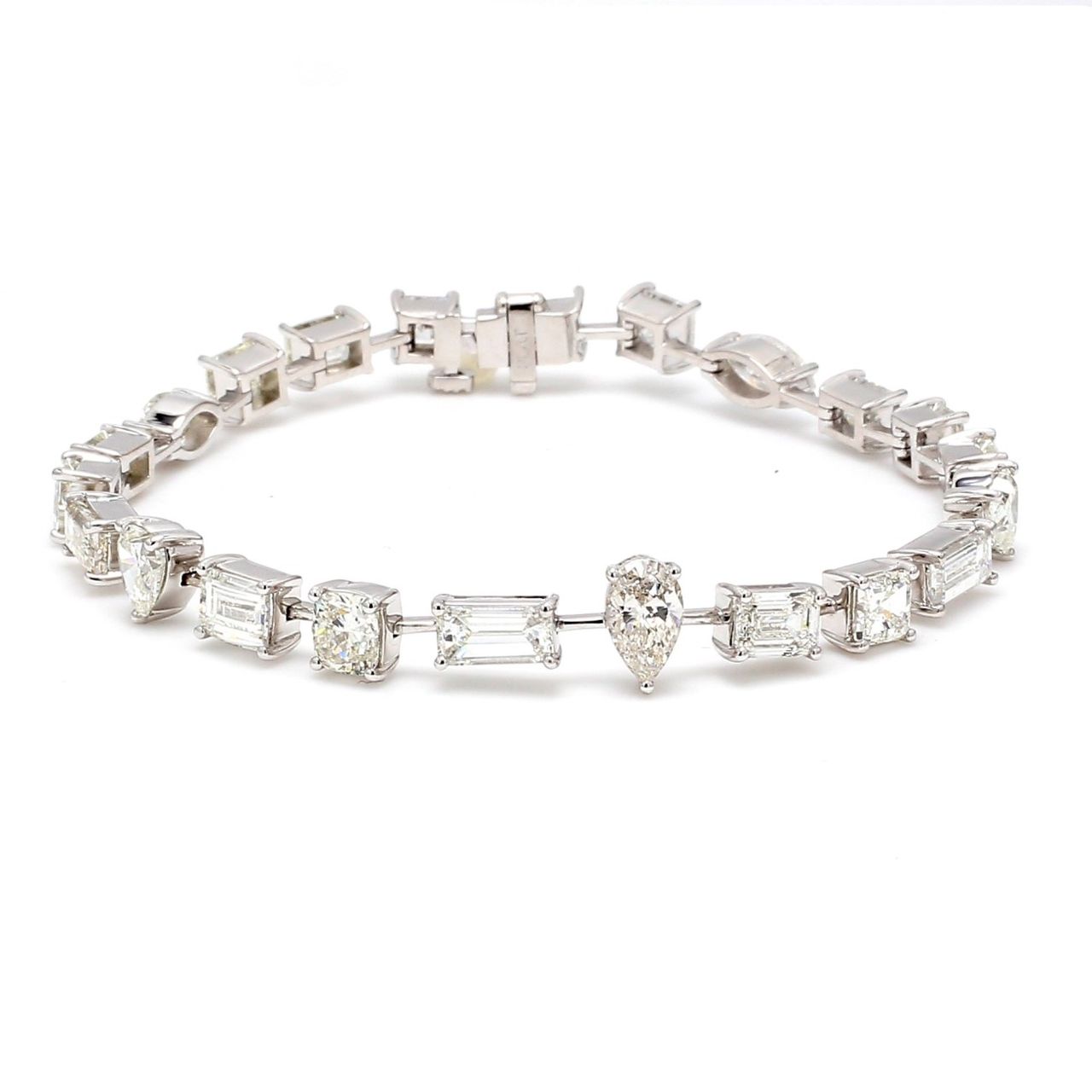 7' Tennis bracelet in platinum with prong set alternating assorted shape diamonds.  D11.43ct.t.w.