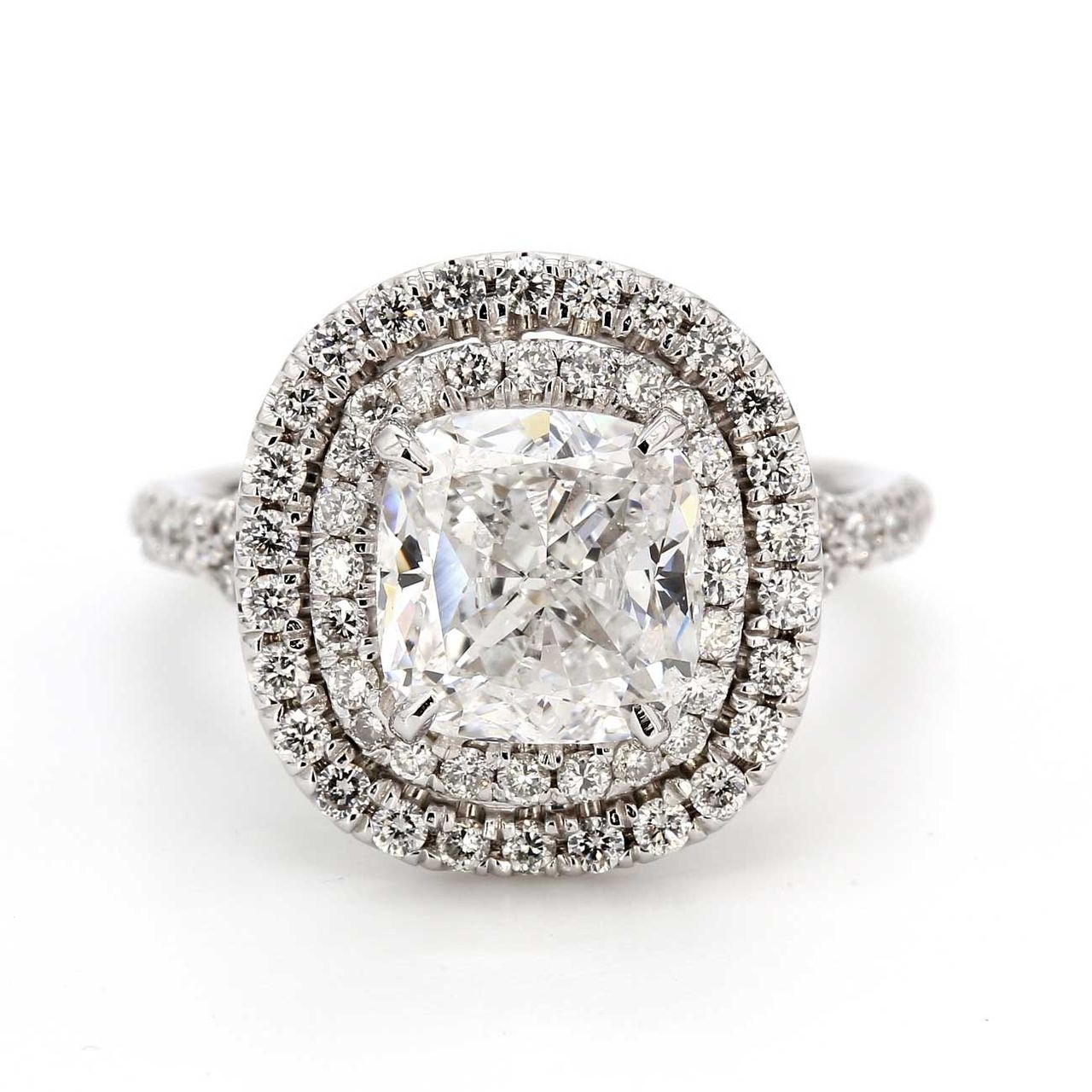 Double halo split-shank semi-mount with prong set round diamonds.  D0.86ct.t.w.