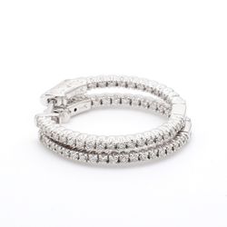 1' Inside out hoop earrings with prong set round diamonds.  D0.69ct.t.w.