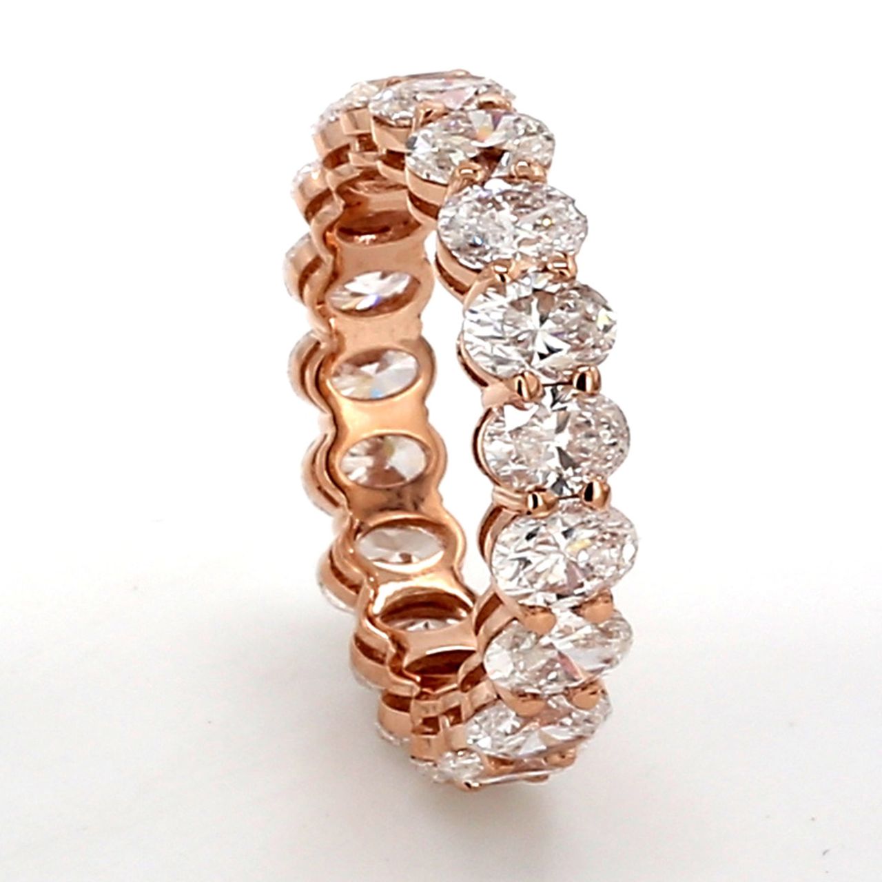 Eternity band in rose gold with basket prong set (19) oval cut diamonds.  D4.00ct.t.w.  Size 5.25