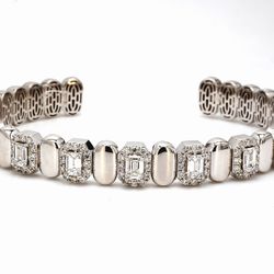 Halo open cuff bangle with alternation gold and 4-prong set (7) emerald cut diamonds.  D2.71ct. t.w.