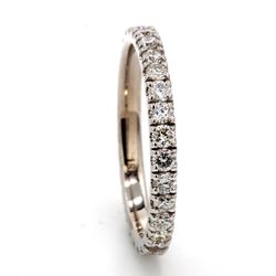 Eternity band in 18K WG white gold with U-prong set (33) round diamonds.  D0.84ct.t.w.  Size 7
