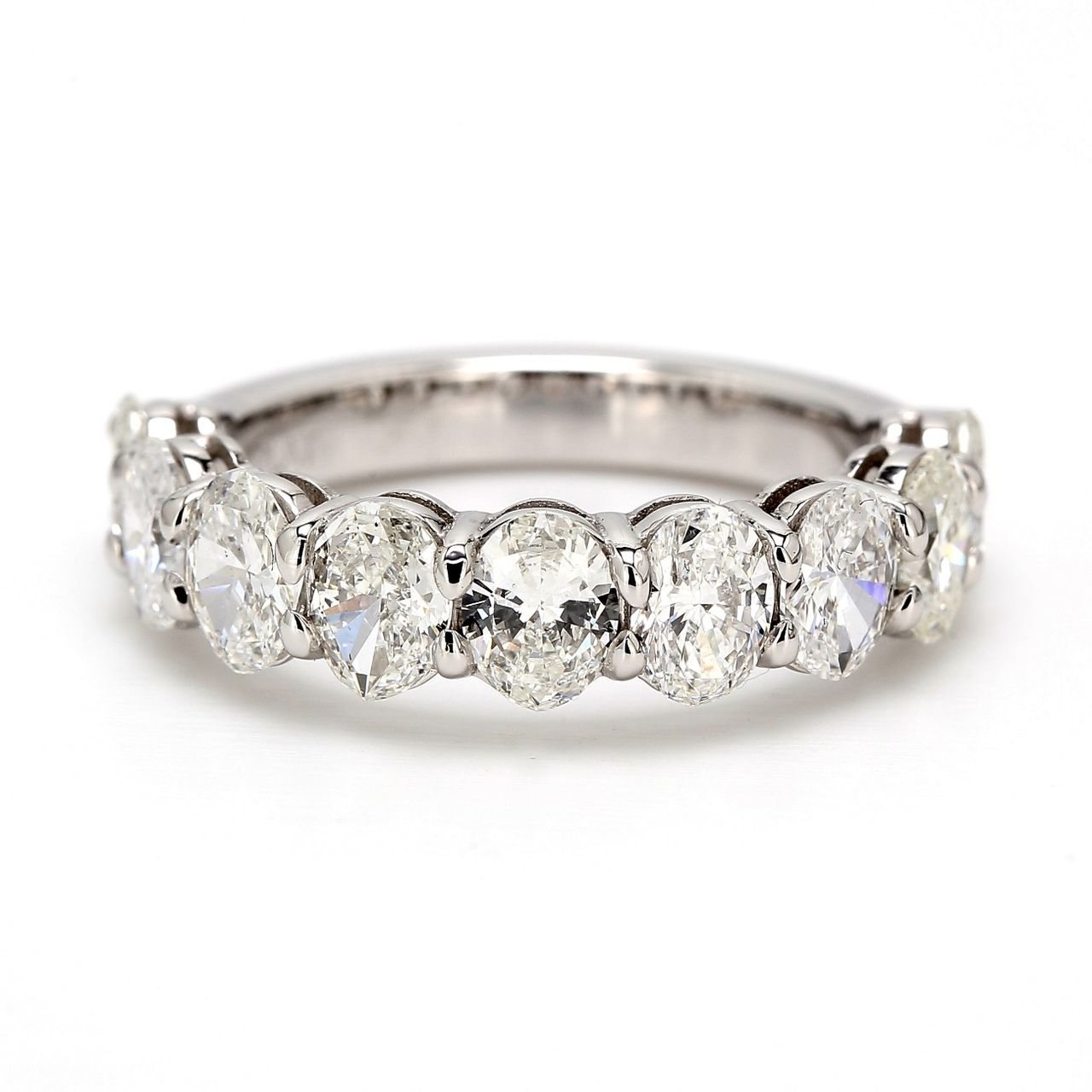 9-stone band in platinum with shared basket prong set oval cut diamonds.  D2.46ct.t.w.  Size 6