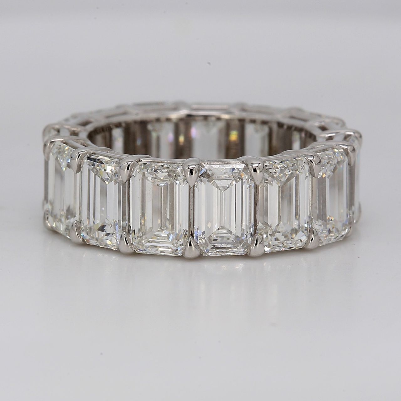 Eternity band in platinum with basket eagle claw set GIA certified E-G/VVS-VS (15) emerald cut diamonds.  D11.02ct.t.w.  Size 6.5