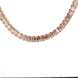 16' Half way graduated tennis necklace in 18K RG with 4-prong basket set (56) emerald cut diamonds.  D17.06ct.t.w.