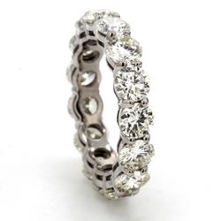 Eternity band in platinum with shared basket prong set (15) round diamonds.  D4.50ct.t.w.  Size 5