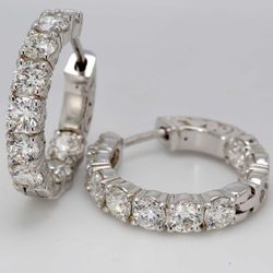 0.75' Inside out hoop earrings with shared prong set round diamonds.  D4.20ct.t.w.