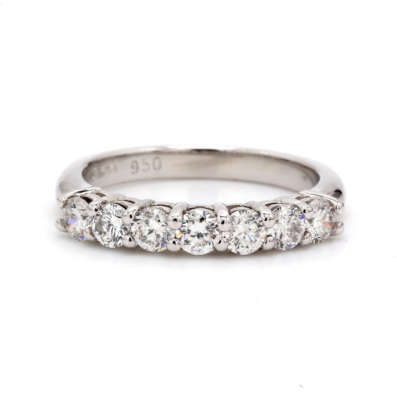 7-stone band in platinum with shared prong set round diamonds.  D0.59ct.t.w.