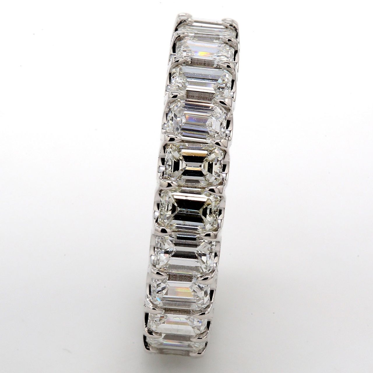 Eternity band in platinum with U-prong set (23) emerald cut diamonds.  D5.54ct.t.w.  Size 8