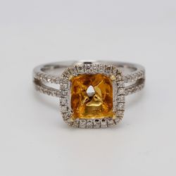 Halo semi-mount in 18K WG with french pave set round diamonds.  D0.60ct.t.w.
