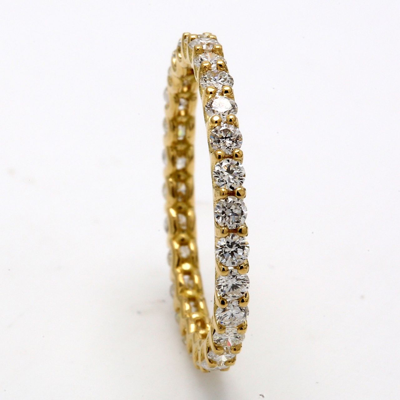 Eternity band in 14K YG with U-prong set (28) round diamonds.  D0.83ct.t.w.  Size 5.75