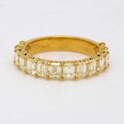 Single row band in 18K YG with shared U-prong set FY/VS (14) emerald cut diamonds.  D3.36ct.t.w.  Size 6
