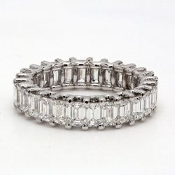 Eternity band in 18K YG with U-prong set (26) emerald cut diamonds.  D4.22ct.t.w.  Size 5.25