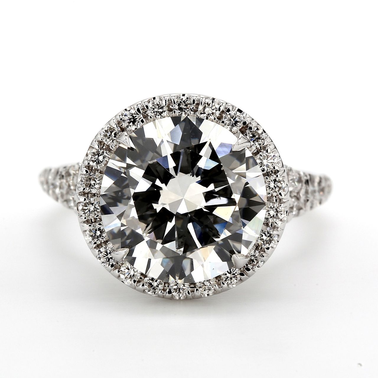 Halo semi-mount in 18K WG prong set round diamond.  D0.62ct.t.w.  Size 6.5