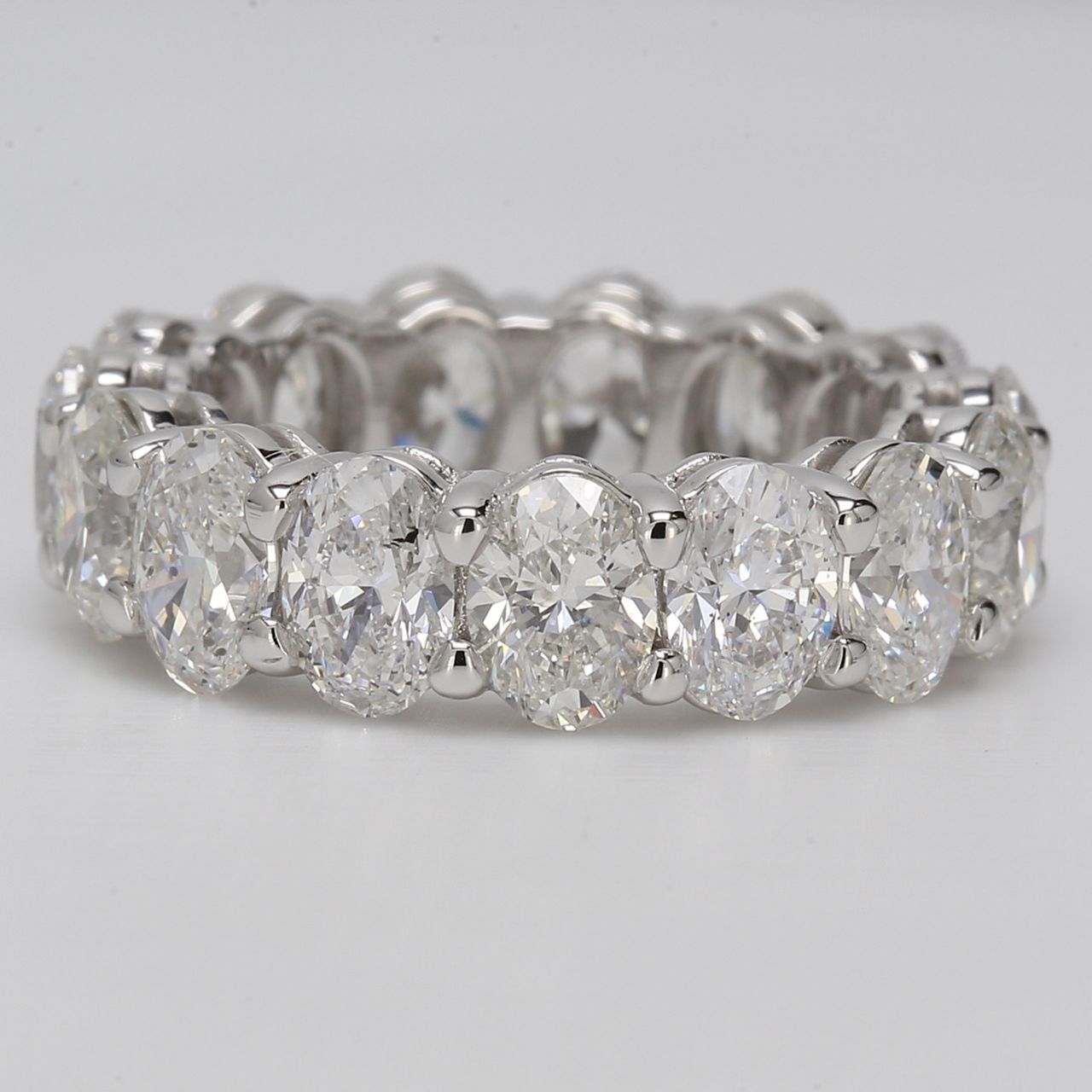 Eternity band in platinum with shared prong set (15) oval diamonds.  D7.71ct.t.w.  Size 6
