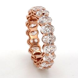 Eternity band in rose gold with basket prong set (19) oval cut diamonds.  D4.00ct.t.w.  Size 5.25