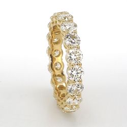 Eternity band in 18K YG with basket prong set (18) round diamonds.  D4.12ct.t.w.  Size 7.25
