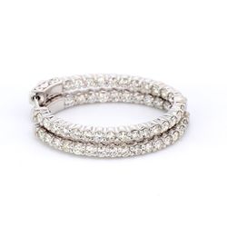 1.25' Oval shaped inside out hoop earrings with shared prong set (54) round diamonds & with special spring lock.  D2.59ct.t.w.