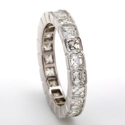 Eternity band in platinum with half bezel set (21) asscher cut diamonds.  D3.23ct.t.w.  Size 6