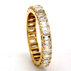Eternity band in 18K YG with prong set (28) emerald cut diamonds.  D2.47ct.t.w.  Size 5