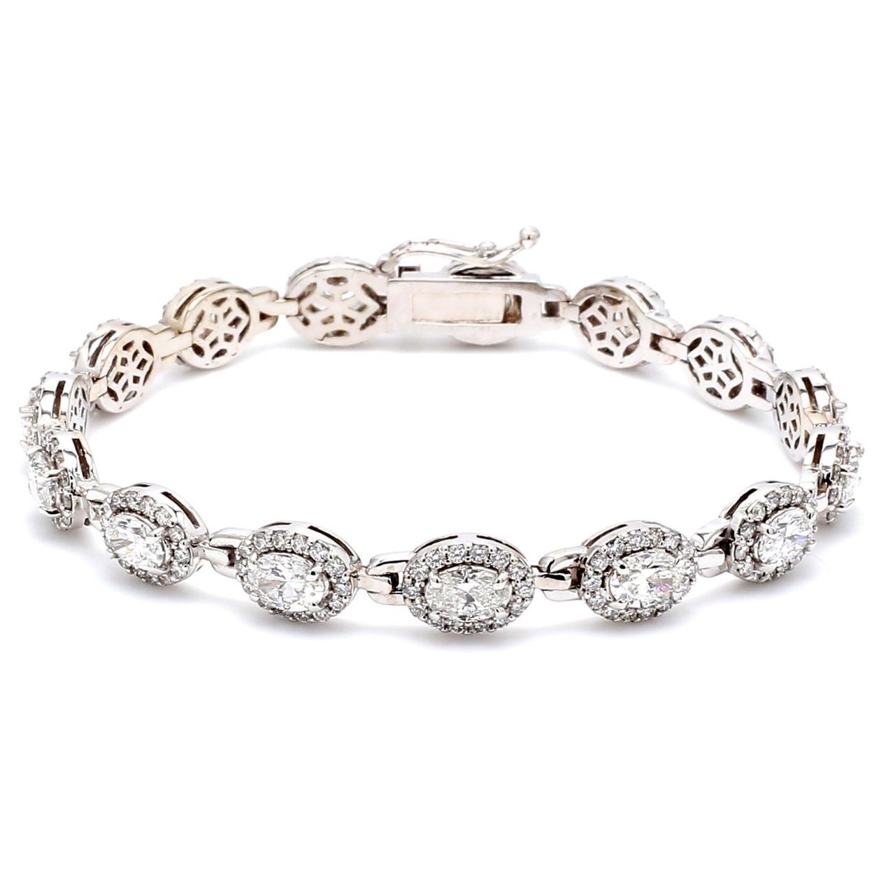 7' Designer bracelet with shared prong set rounds and 4-prong set oval cut diamonds.  D6.96ct.t.w.