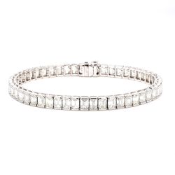 7' Tennis bracelet in platinum with half bezel set (54) emerald cut diamonds.  D13.04ct.t.w.