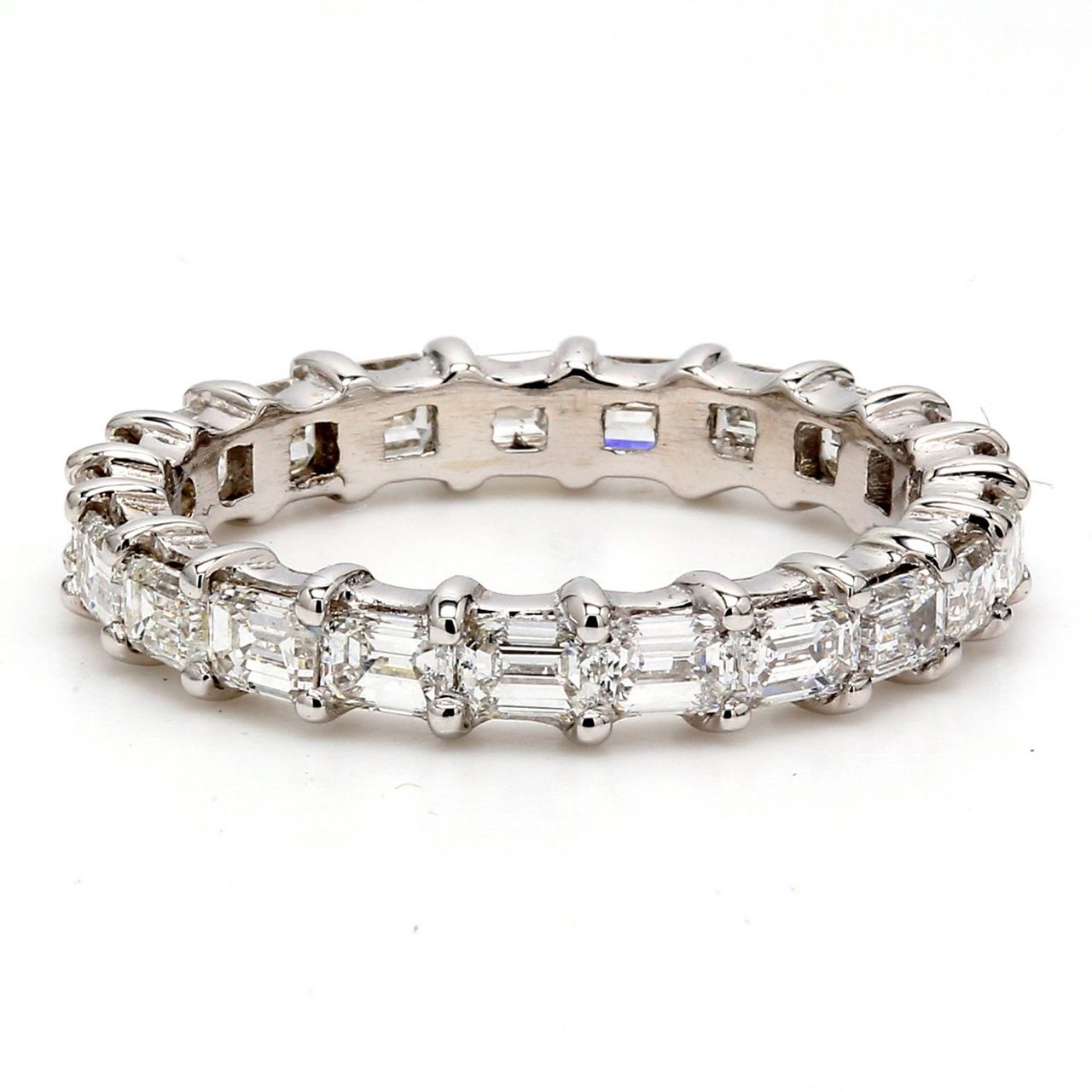 East to west style eternity band with shared prong set (21) emerald cut diamonds.  D2.16ct.t.w.  Size 6