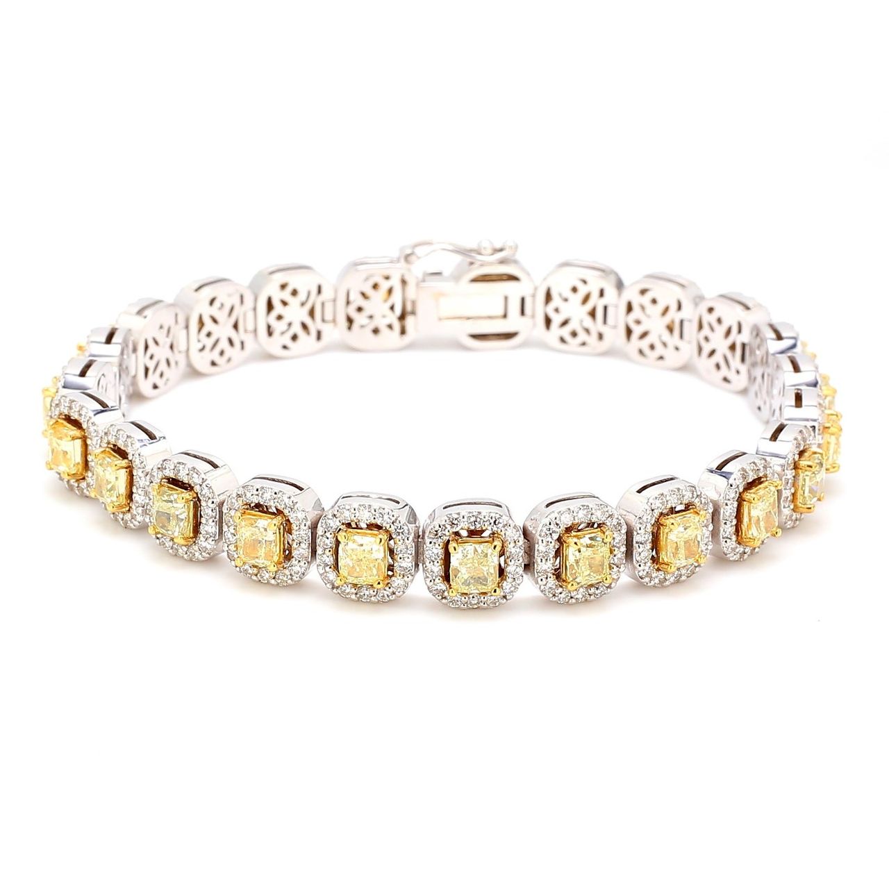 7' Halo tennis bracelet in 18K WG with prong set rounds around FY cushion cut diamond centers.  D10.43ct.t.w.